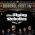 Festival poster for 'DOBEREL FEST IV' featuring flaming skulls, chains, and a group of rock musicians beneath the banner with a guitar motif.