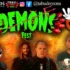 Promotional poster for Demonzone Fest showing four metal musicians against a fiery, orange-yellow background with band logos along the top edge.